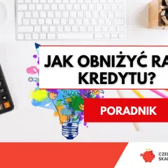 Kalkulator, klawiatura i kolorowe kredki na biurku. Napis "JAK OBNIŻYĆ RATĘ KREDYTU?" sugeruje poradnik finansowy.